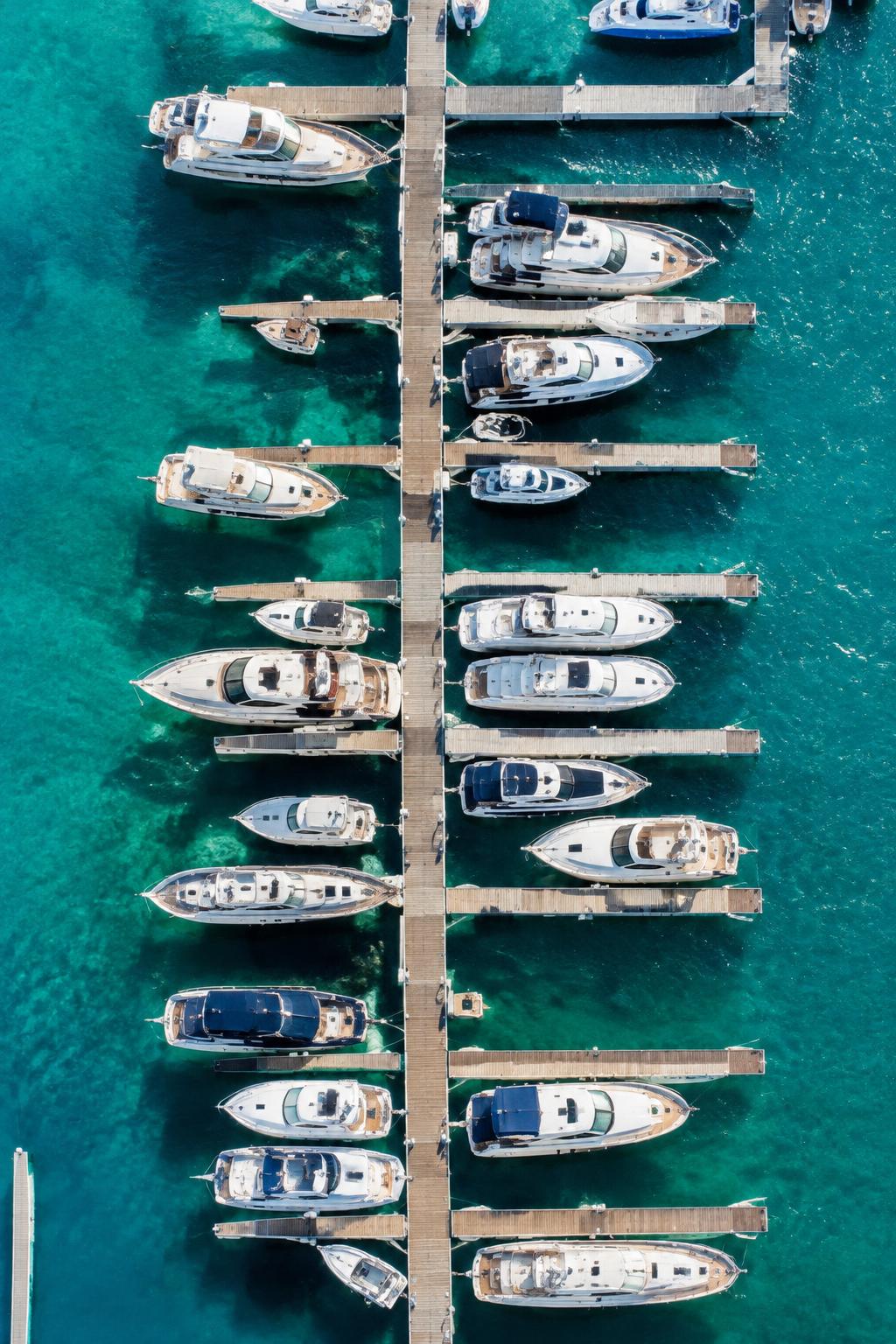 Aerial view of marina docks and yachts
